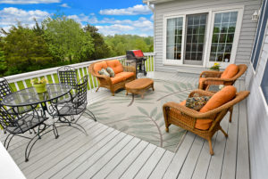 Deck with lawn chairs of home in River Falls WI on a nice summer day with big puffy clouds